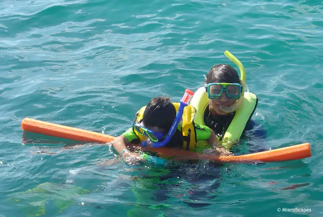 Snorkeling with kids: get a floating sausage for support